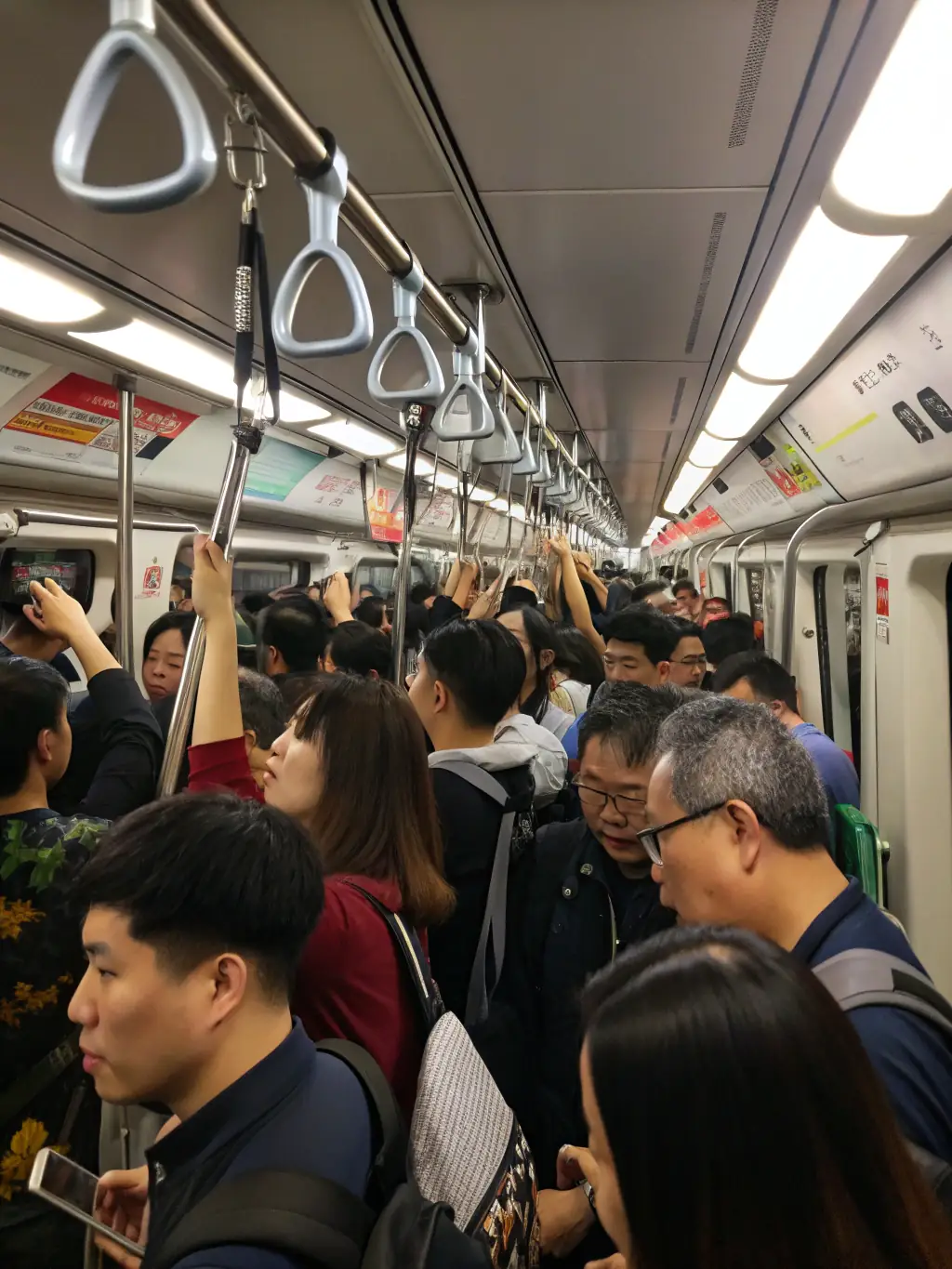 A photograph depicting a crowded commuter train in Johannesburg, South Africa, symbolizing the daily stress and challenges faced by many working individuals.